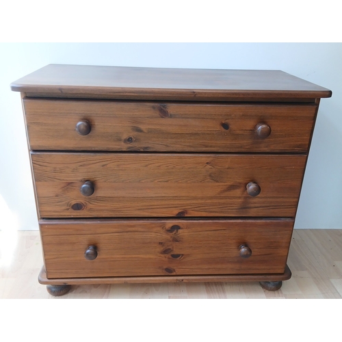 Pine chest of drawers, the rounded-rectangular top above thr...
