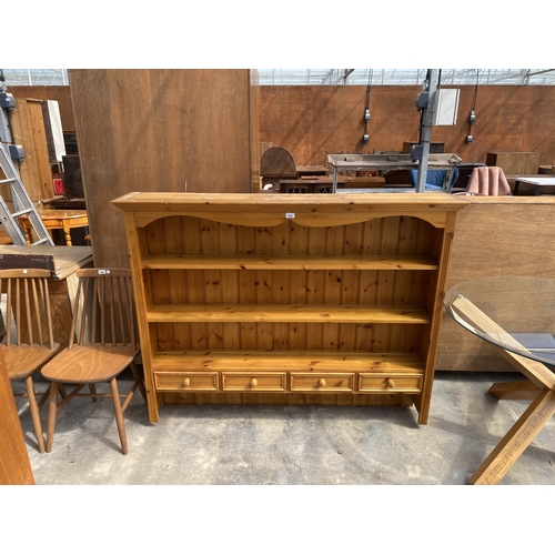 A PINE DRESSER RACK ENCLOSING FOUR DRAWERS, 60" WIDE