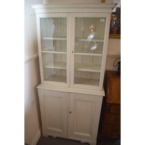 White painted pine cabinet bookcase, with two doors above tw...