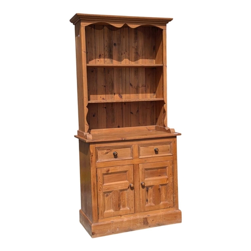 Reclaimed pine Welsh dresser. Plinth base with cupboards and...