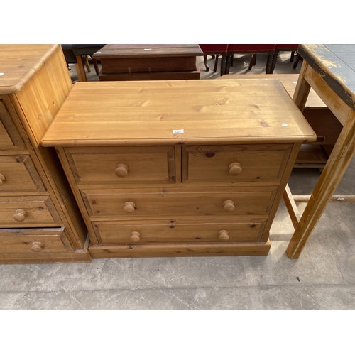 A VICTORIAN STYLE PINE CHEST OF TWO SHORT AND TWO LONG DRAWE...