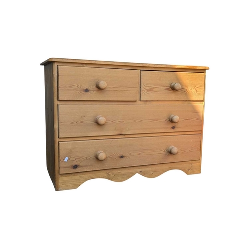 A vintage 20th century pine chest of drawers. Two over two c...