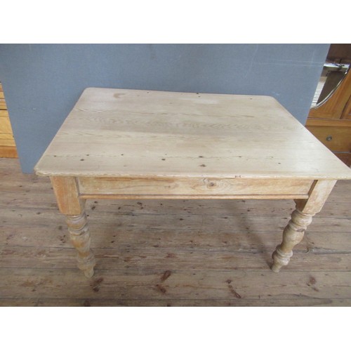 A pine kitchen table, fitted with an end drawer, 47ins x 36i...