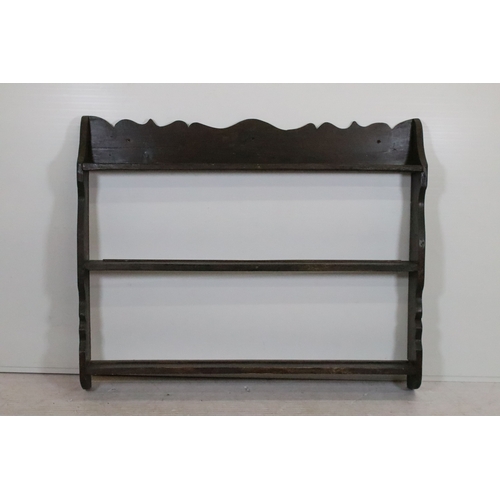 20th century stained pine wall hanging plate rack, having th...