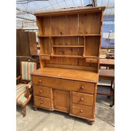 A VICTORIAN STYLE PINE DRESSER WITH RACK AND FIVE DRAWERS AN...
