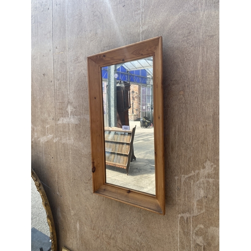A PINE FRAMED WALL MIRROR, 28" X 16"