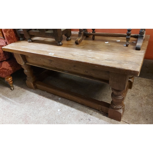 A 1.08cm solid pine coffee table, set on squat turned legs