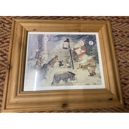 A PINE FRAMED PRINT OF A WINTER WINNIE THE POOH SCENE WITH C...