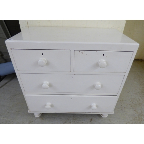 An early 20thC white painted pine, four drawer dressing ches...