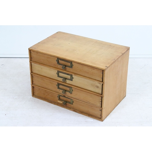 20th century pine table top chest of drawers, having four lo...