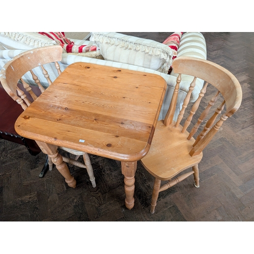 A square pine vanished occasional table with a pair of farmh...