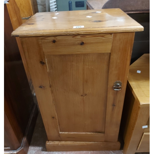 A 46cm vintage pine bedside cabinet, with panelled door encl...