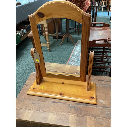A pine swivel dressing mirror