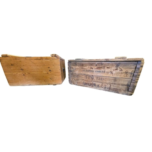 Two large vintage 20th century wooden crates, one with Sadle...