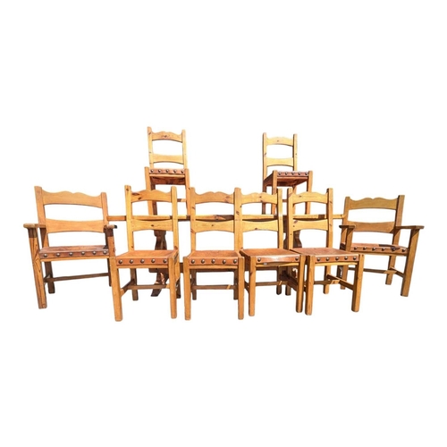 A 20th century pine farmhouse dining table and chairs. The t...