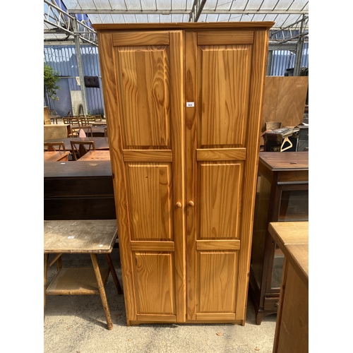 A PINE TWO DOOR WARDROBE, 34" WIDE