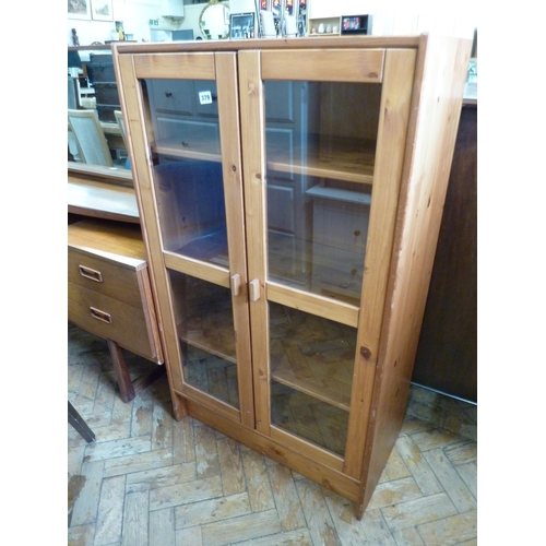 Glazed pine bookcase