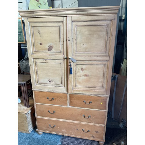 An antique pine linen press the top having three slide drawe...