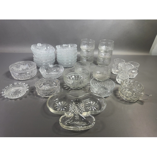 An Assortment of Clear Cut and Textured Glass Tableware incl...