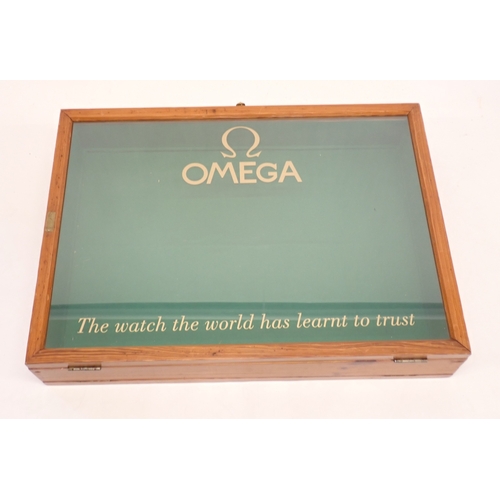 An Omega glazed shop display case 'The Watch the World has l...