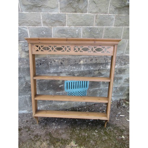 A pine hanging set of wall shelves
