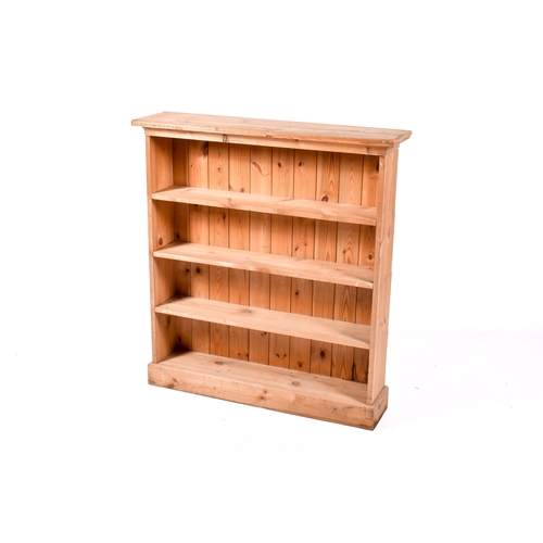 A freestanding pine bookcase. H107cm x W98cm x D24cm