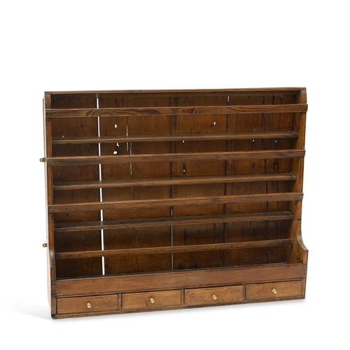 A 19TH CENTURY PINE PLATE RACK with a boarded back and four ...