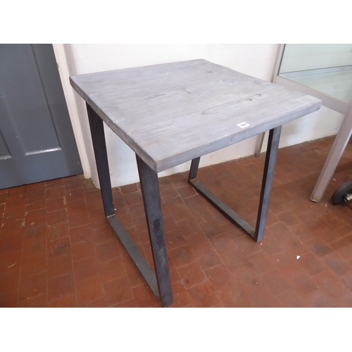 Painted reclaimed pine table on industrial steel legs