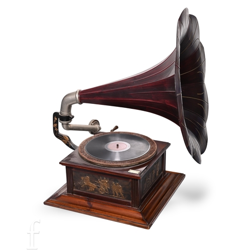 A 1920s continental horn gramophone, deep red painted tin ho...