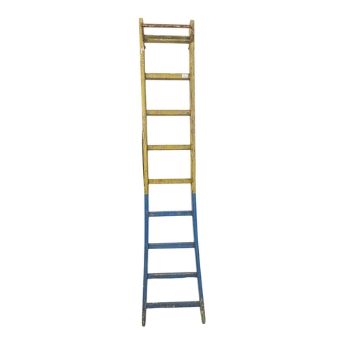 A vintage 20th century painted pine ladder, In blue and yell...