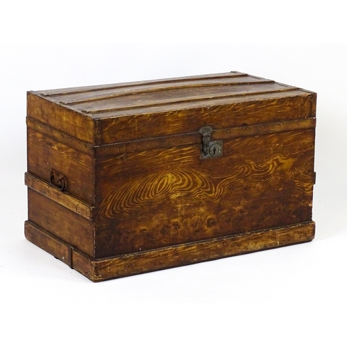 A late 19thC / early 20thC scumbled pine trunk flanked by wr...