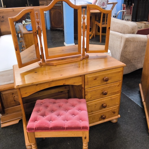 Two pine chests of drawers and a dressing table