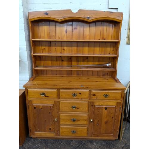 A pine kitchen dresser with shelf back fitted six drawers an...