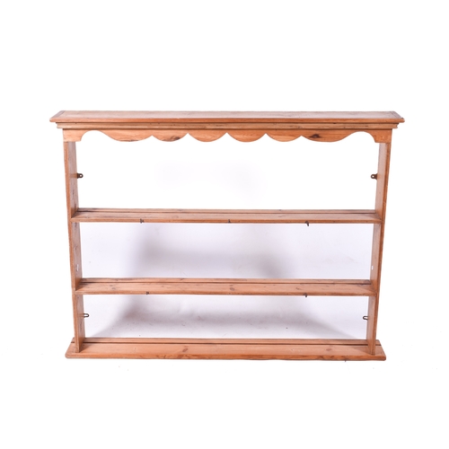 A vintage pine wall mounted plate rack. H97cm x W129cm x D16...