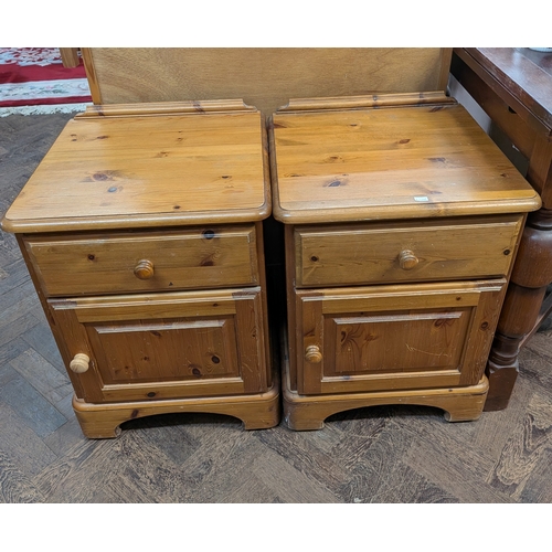 A pair of pine bedside cabinets, each fitted one drawer and ...