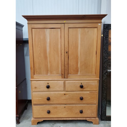 An antique pine Cupboard with pair of cupboard doors enclosi...