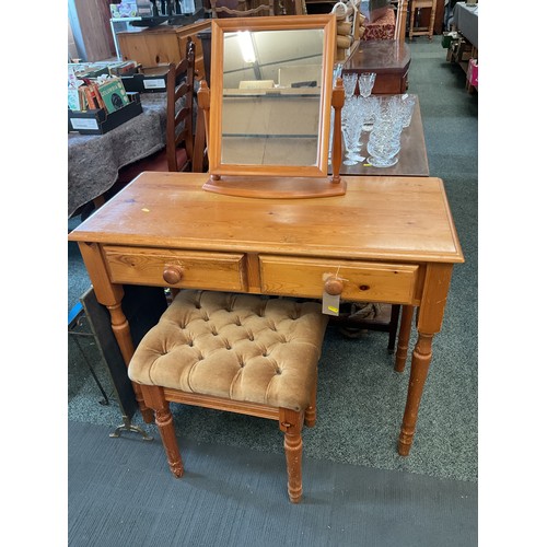 A pine two drawer dressing table