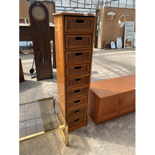 A PINE BATHROOM CHEST ENCLOSING NINE WICKER DRAWERS, 16" WID...