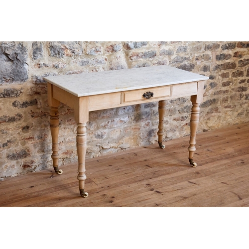 A VICTORIAN PINE AND MARBLE-TOPPED WASHSTAND A VICTORIAN PIN...