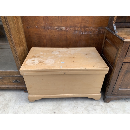 A VICTORIAN STRIPPED PINE BLANKET CHEST WITH IRON CARRYING H...