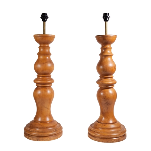 A pair of large turned pine table lamps, second half 20th ce...