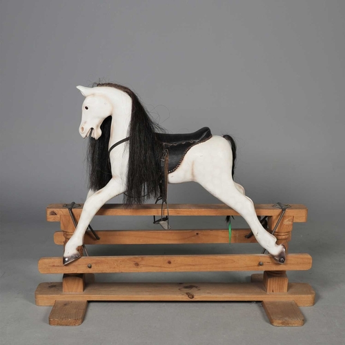 ROCKING HORSE painted, black leather and pine, 104cm H x 135...