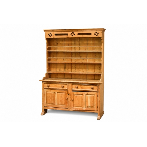 A rustic pine farmhouse kitchen dresser. Having open shelves...