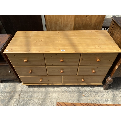 A PINE EFFECT CHEST OF SIX SHORT AND TWO LONG DRAWERS, 48" W...