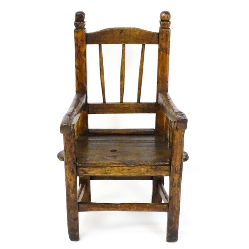 A late 18thC / early 19thC pine child's chair with spindle t...