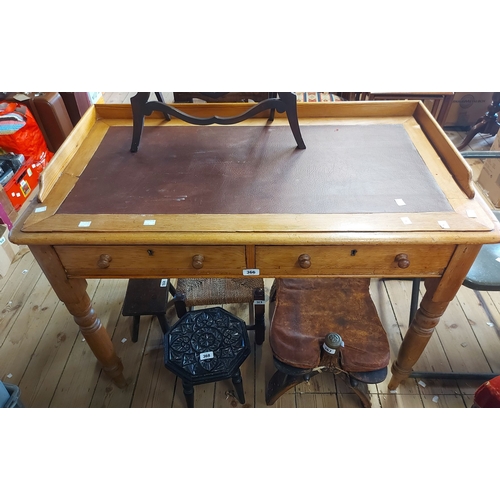 A 1.03m Victorian pine writing table with galleried top over...
