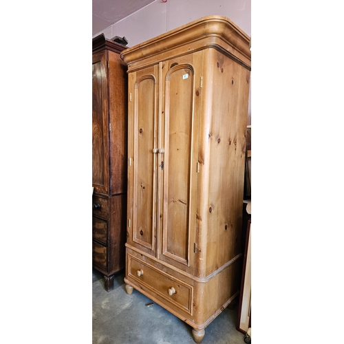 Good quality antique pine wardrobe with arched panel doors a...