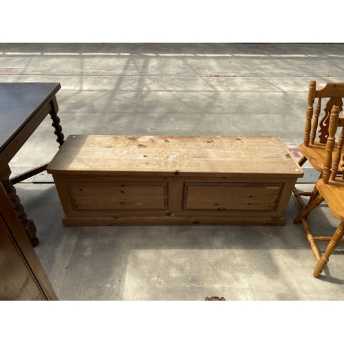 A PINE BLANKET CHEST WITH PANELLED FRONT, 60" WIDE