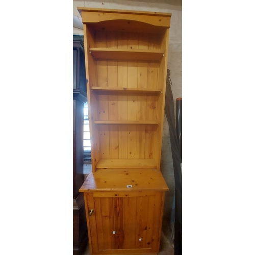 A 65cm two part vintage pine cabinet the open top section wi...