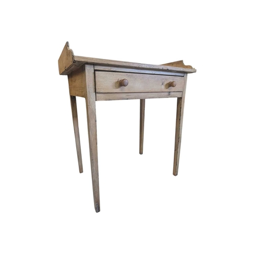 A 19th century Victorian pine gallery back writing desk. The...